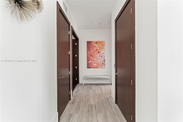 corridor featuring light hardwood / wood-style floors