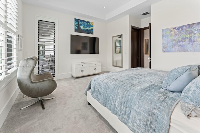 bedroom with light colored carpet