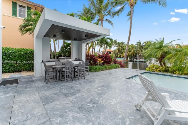 view of patio / terrace featuring ceiling fan