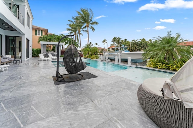 view of pool featuring a patio area