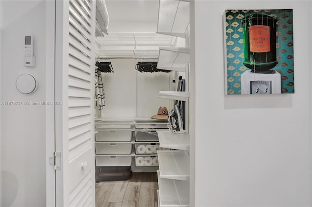 walk in closet featuring hardwood / wood-style floors