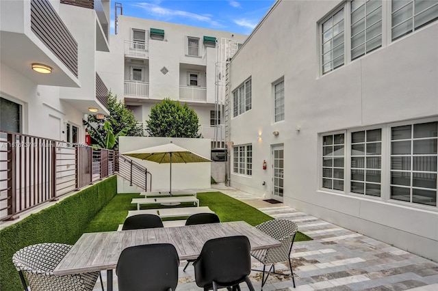 view of patio with a balcony