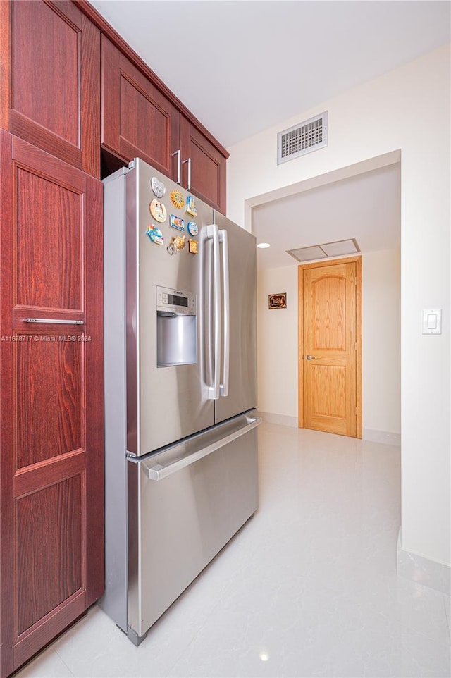 kitchen featuring stainless steel fridge