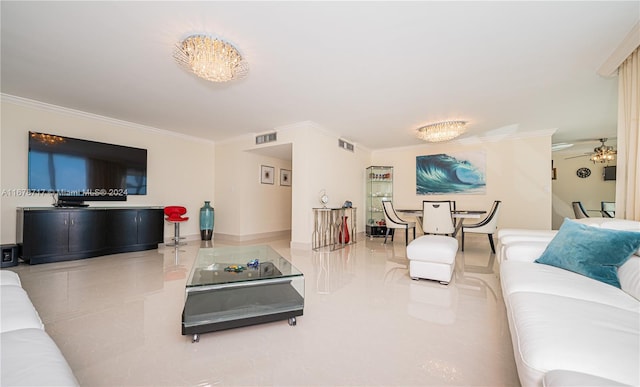 living room with ceiling fan and ornamental molding