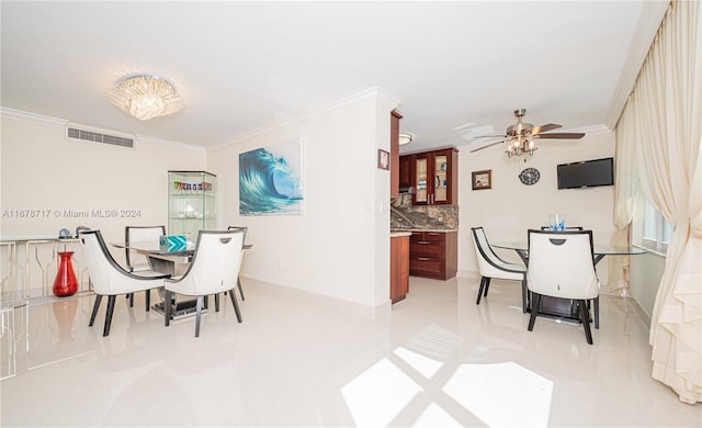 tiled dining room featuring ceiling fan and crown molding