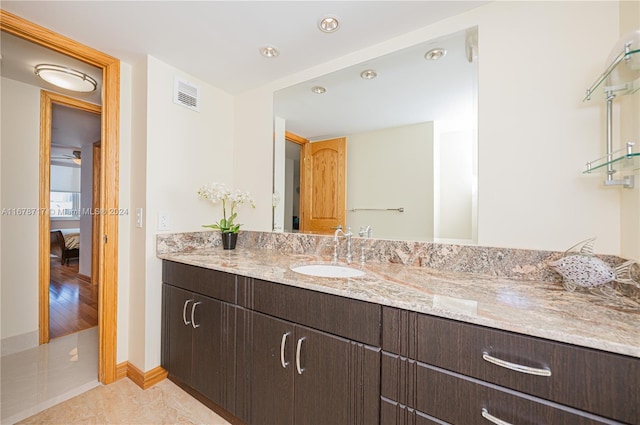 bathroom with vanity and hardwood / wood-style flooring