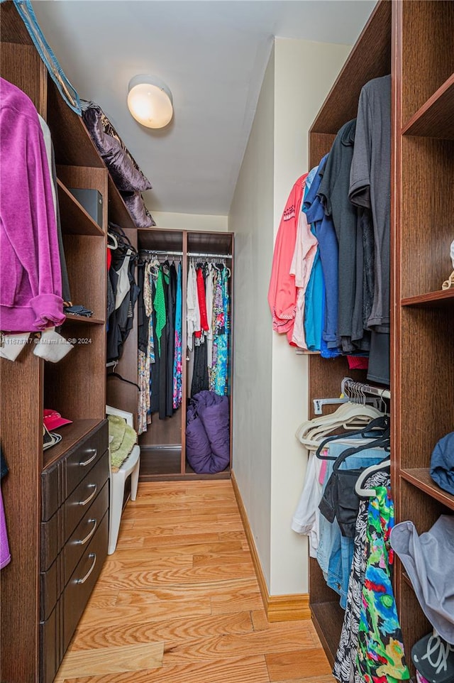 walk in closet featuring light wood-type flooring