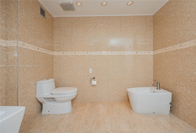 bathroom featuring toilet, tile walls, and ornamental molding