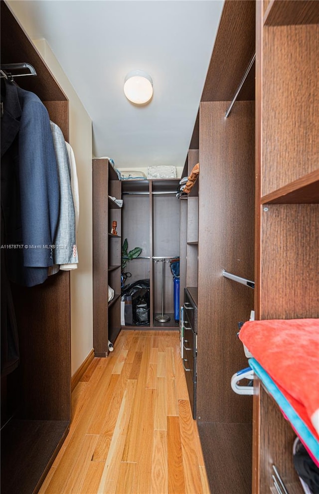 spacious closet featuring light wood-type flooring