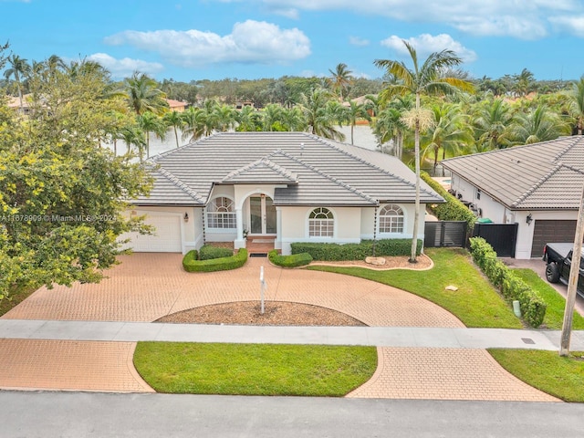 view of front of house with a front lawn and a garage