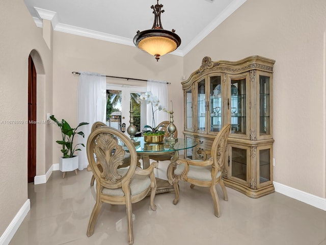 dining area featuring french doors and ornamental molding