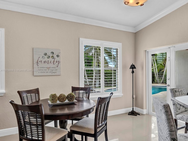 dining space featuring ornamental molding