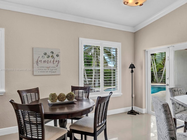 9026 NW 173rd Ter, Hialeah, FL 33018 - tiled dining room with crown molding and baseboards