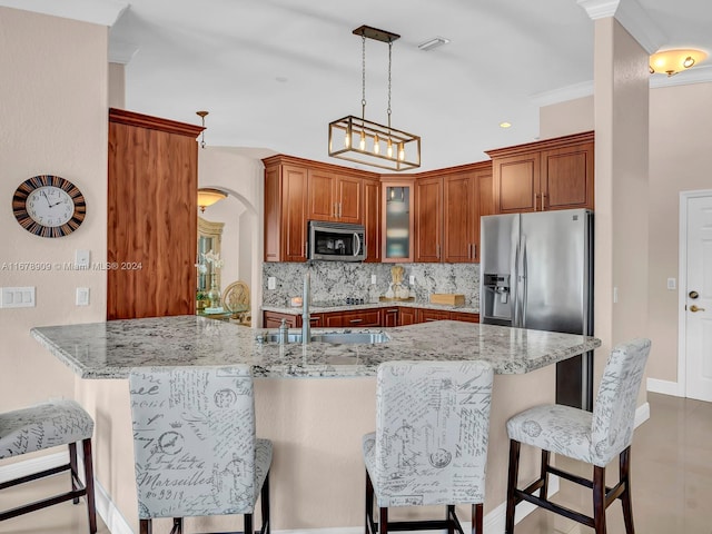 kitchen featuring kitchen peninsula, tasteful backsplash, light stone counters, crown molding, and stainless steel appliances