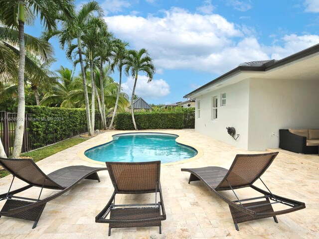 view of swimming pool featuring a patio