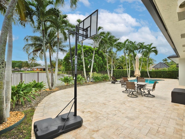 view of patio with a fenced in pool