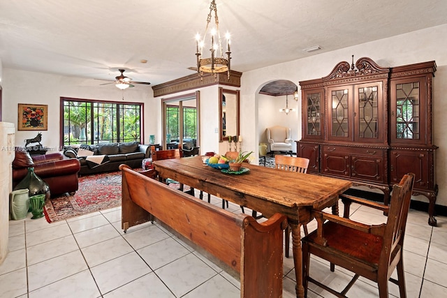 dining space with light tile patterned flooring and ceiling fan