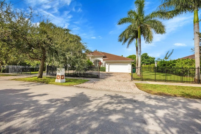 view of front facade with a front yard and a garage