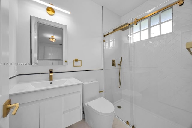 bathroom with vanity, a shower with shower door, toilet, and tile patterned floors