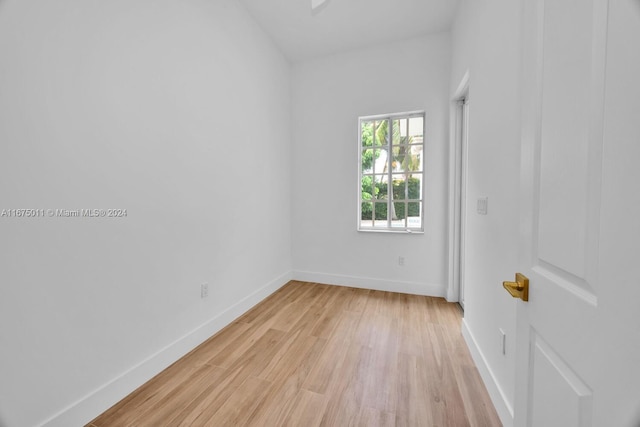 spare room featuring light hardwood / wood-style floors