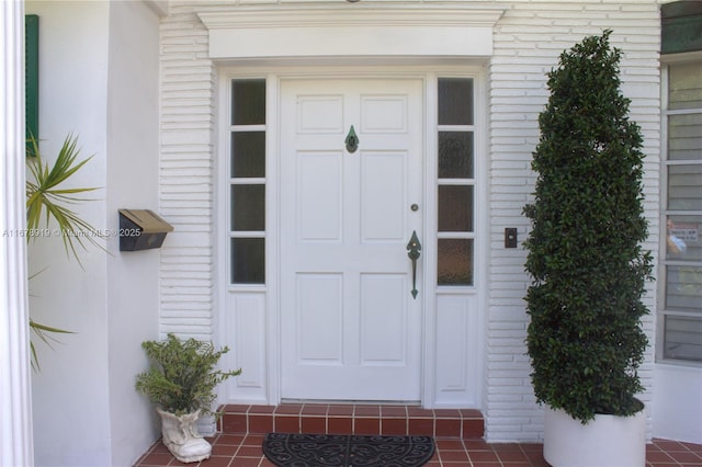 3440 NE 170th St, North Miami Beach, FL 33160 - view of exterior entry featuring brick siding