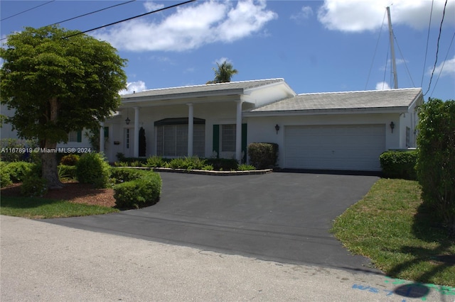 view of front of property with a garage