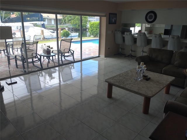 unfurnished living room with tile patterned floors