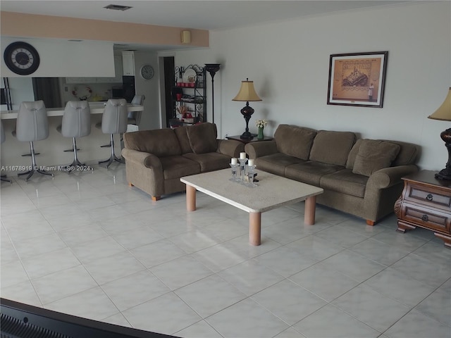 living room with light tile patterned floors