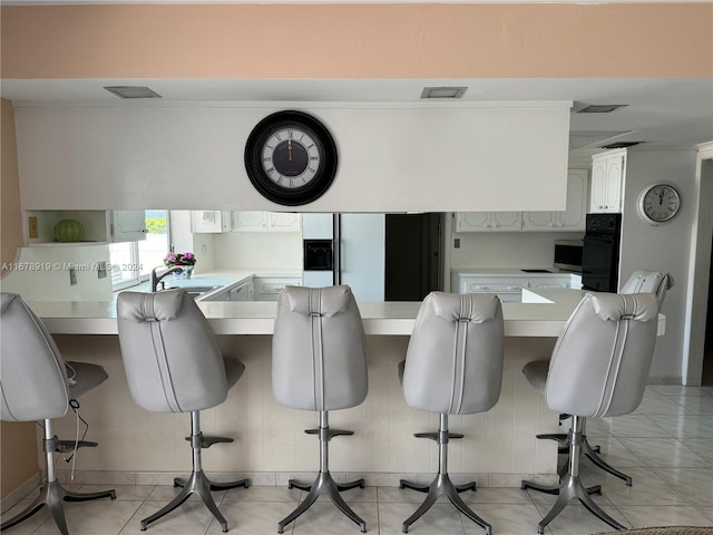 tiled dining area with sink