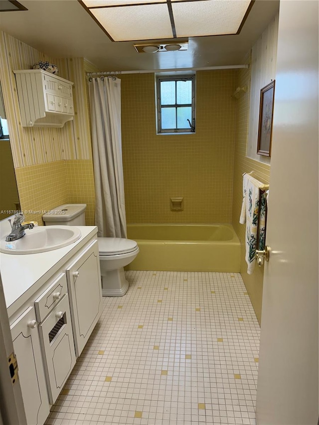 3440 NE 170th St, North Miami Beach, FL 33160 - bathroom featuring toilet, vanity, tile patterned floors, and shower / bath combo with shower curtain