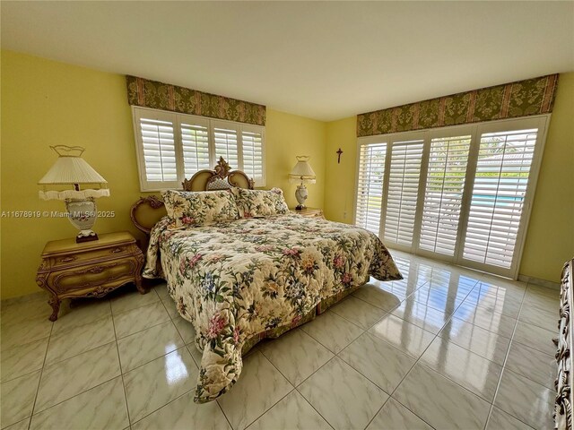 3440 NE 170th St, North Miami Beach, FL 33160 - bedroom with tile patterned flooring and access to exterior