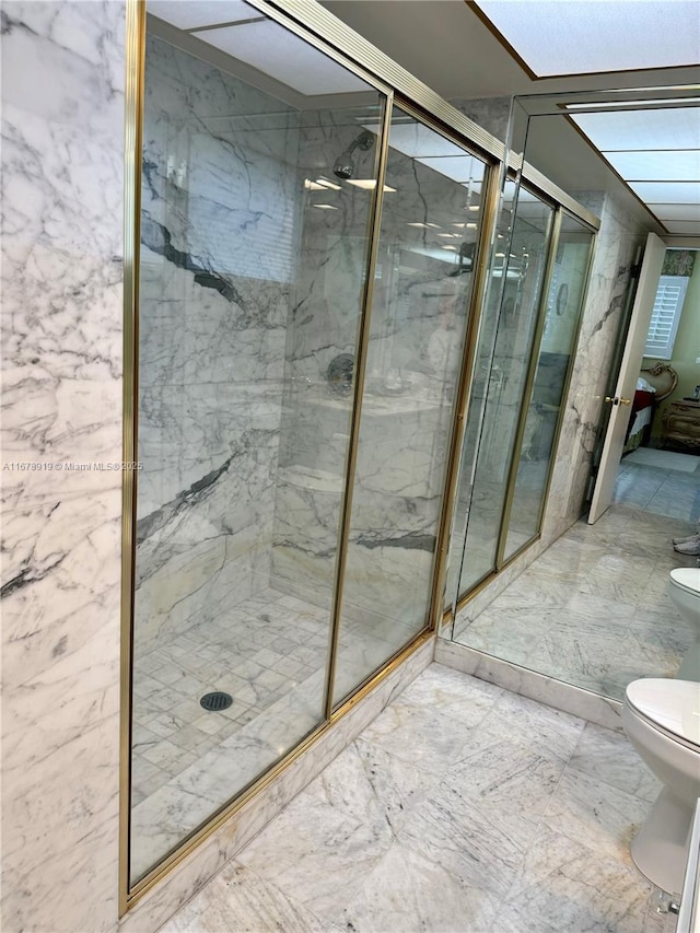 3440 NE 170th St, North Miami Beach, FL 33160 - bathroom featuring a marble finish shower and toilet