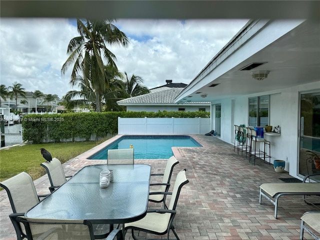3440 NE 170th St, North Miami Beach, FL 33160 - view of pool with a fenced in pool, outdoor dry bar, a fenced backyard, outdoor dining space, and a patio