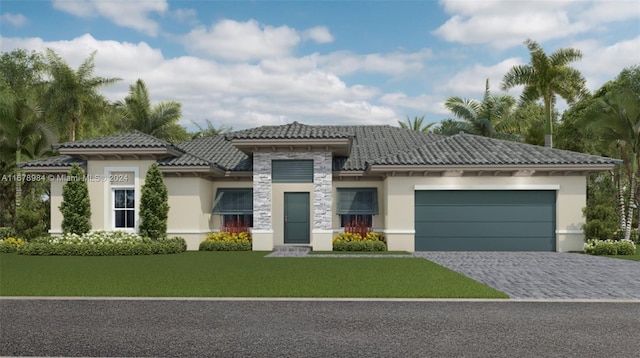 view of front of home featuring a front yard and a garage