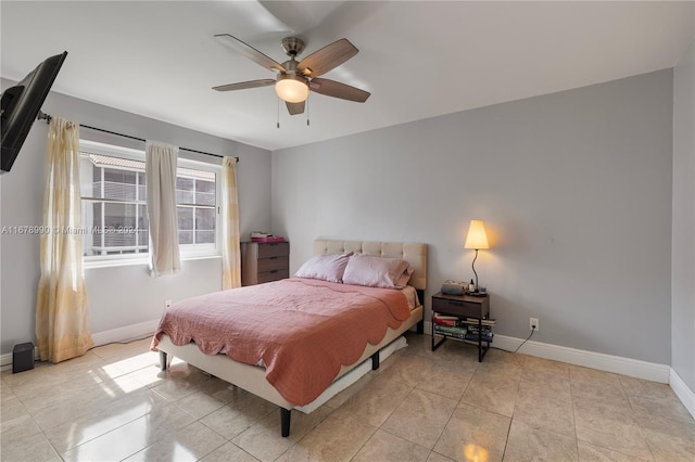 tiled bedroom with ceiling fan