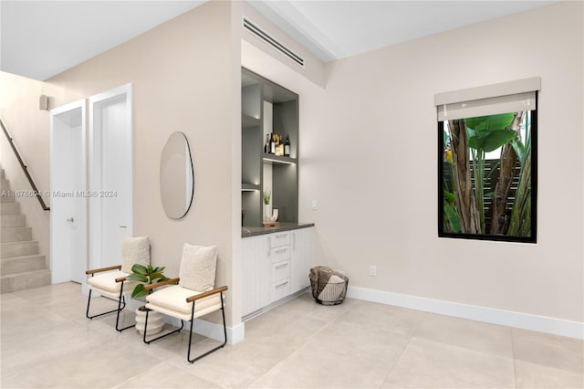 living area with light tile patterned floors