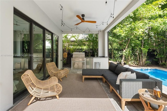 view of patio / terrace featuring an outdoor kitchen, an outdoor hangout area, sink, ceiling fan, and area for grilling