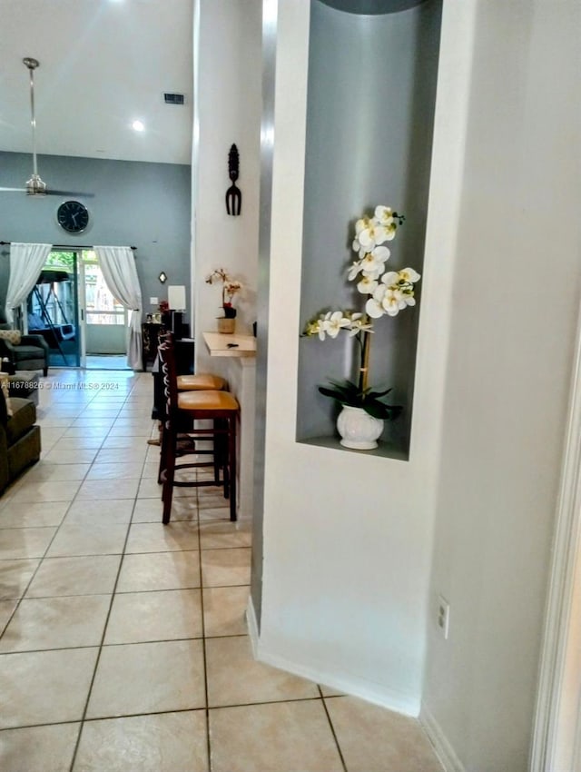 hallway featuring light tile patterned flooring