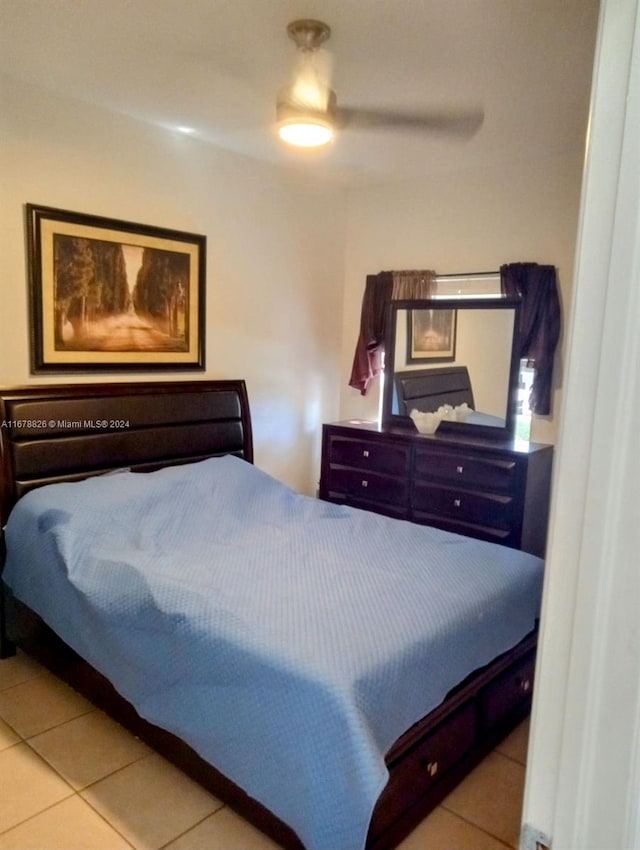 bedroom featuring ceiling fan and light tile patterned floors