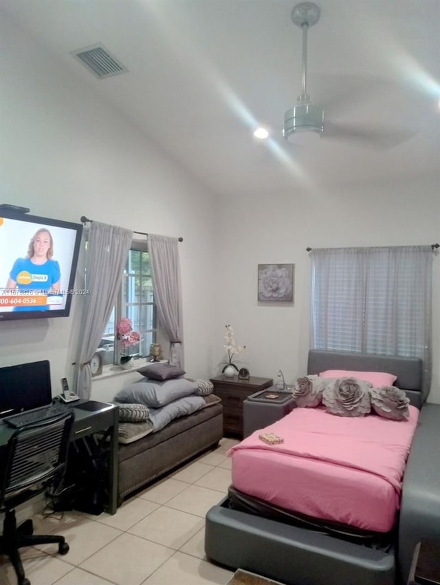 tiled bedroom with lofted ceiling