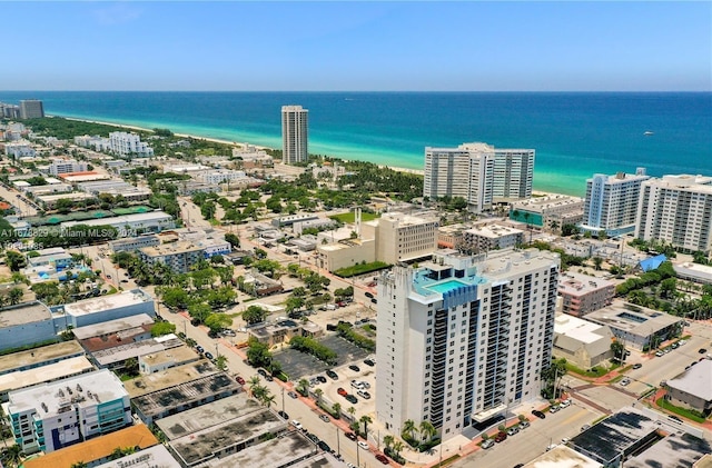 drone / aerial view with a water view and a view of the beach