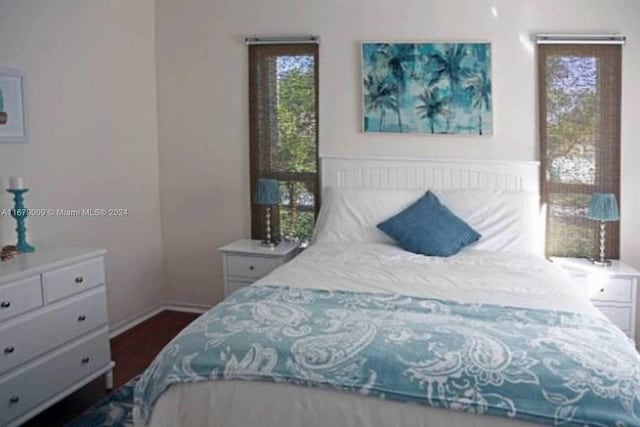 bedroom featuring dark hardwood / wood-style flooring