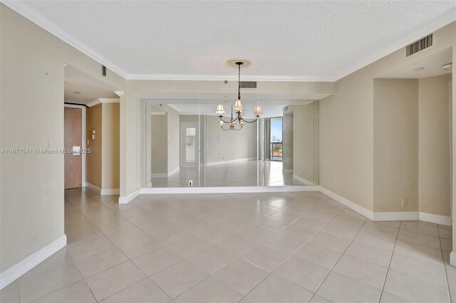 20185 E Country Club Dr Unit 2209, Aventura, FL 33180 - unfurnished room with a chandelier, crown molding, light tile patterned floors, baseboards, and a textured ceiling