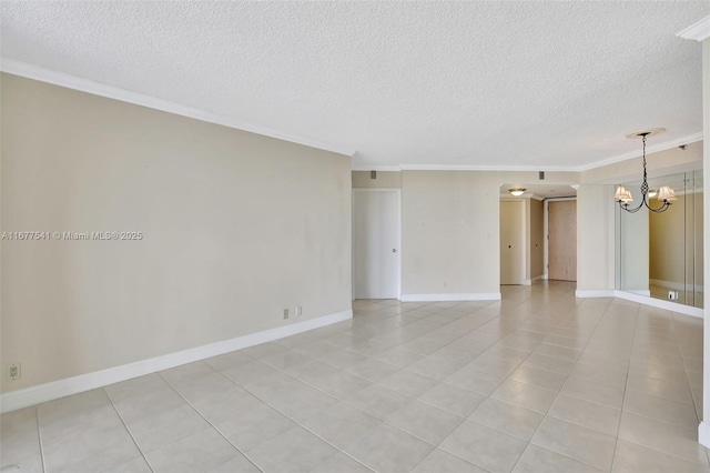 tiled spare room with a textured ceiling, an inviting chandelier, and crown molding