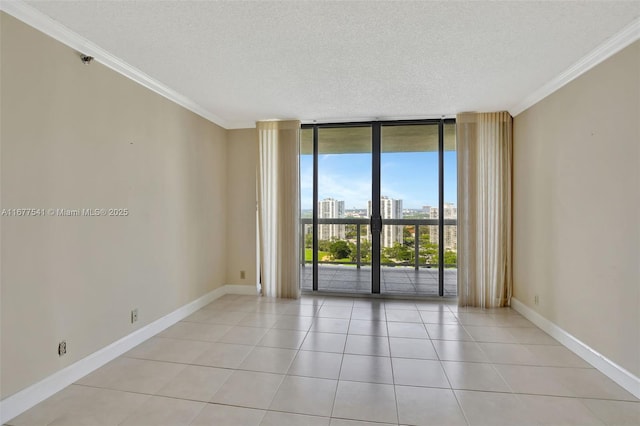 20185 E Country Club Dr Unit 2209, Aventura, FL 33180 - empty room featuring a wall of windows, ornamental molding, a textured ceiling, a city view, and light tile patterned flooring
