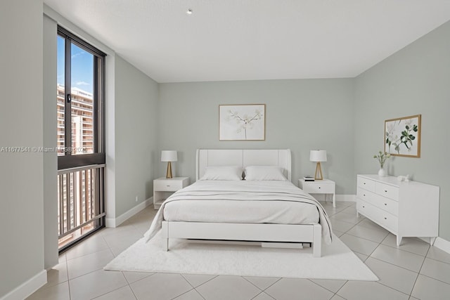20185 E Country Club Dr Unit 2209, Aventura, FL 33180 - bedroom featuring baseboards and light tile patterned flooring