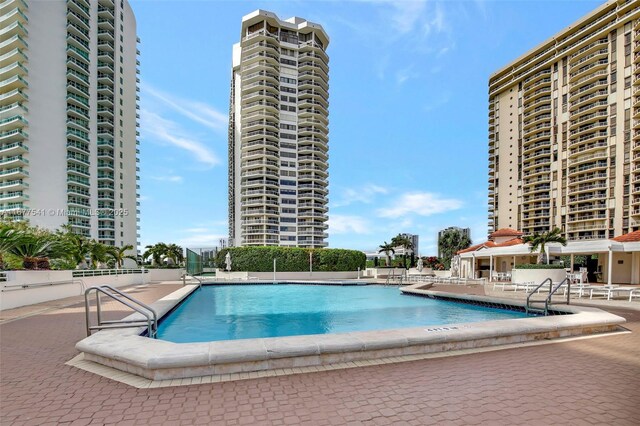 20185 E Country Club Dr Unit 2209, Aventura, FL 33180 - community pool with a patio area