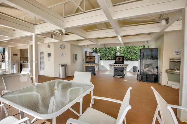 dining area featuring beam ceiling and coffered ceiling