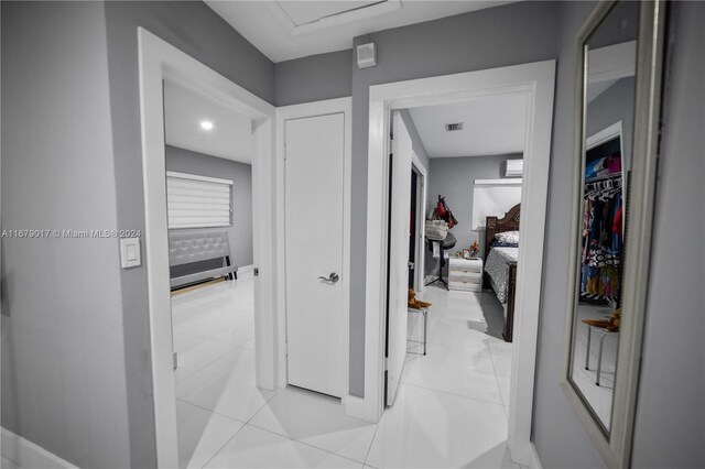 13550 SW 99th Pl, Miami, FL 33176 - corridor with baseboards, a wall unit AC, and light tile patterned floors