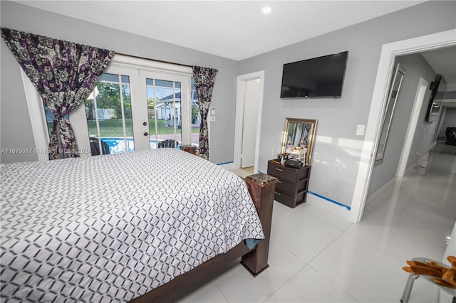 bedroom with access to outside and light tile patterned flooring